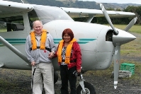 Donald & Edna Kerr in front of airplane