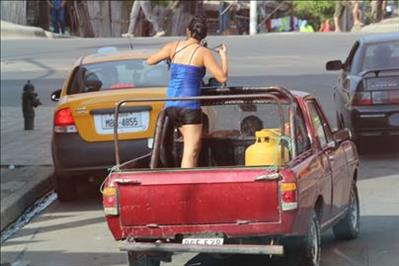 Lady in back of truck