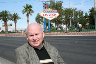 Donald Kerr with Welcome Sign in back